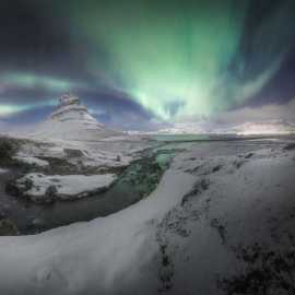 aurora boreale e neve sopra al kirkjufell viaggio fotografico islanda